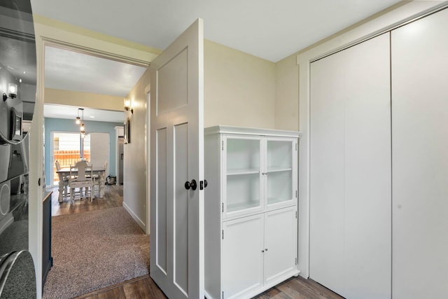 corridor with dark wood finished floors
