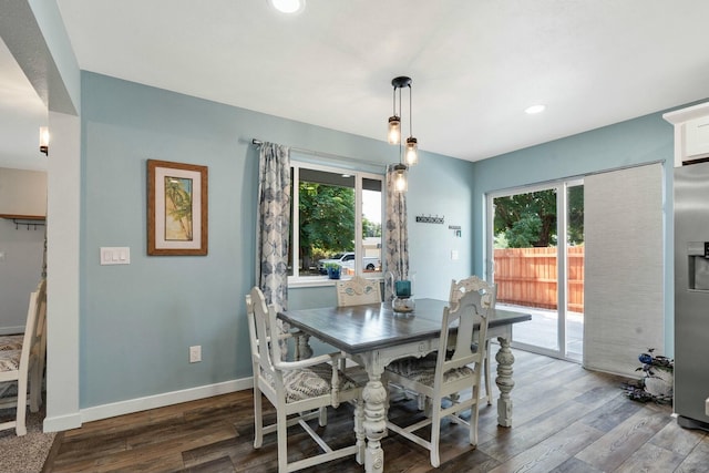 dining space with plenty of natural light, baseboards, wood finished floors, and recessed lighting