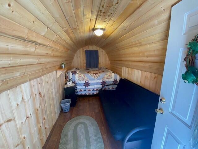 158 Teal Rd, Usk, WA 99180 - bedroom with wooden walls, hardwood / wood-style flooring, and wood ceiling