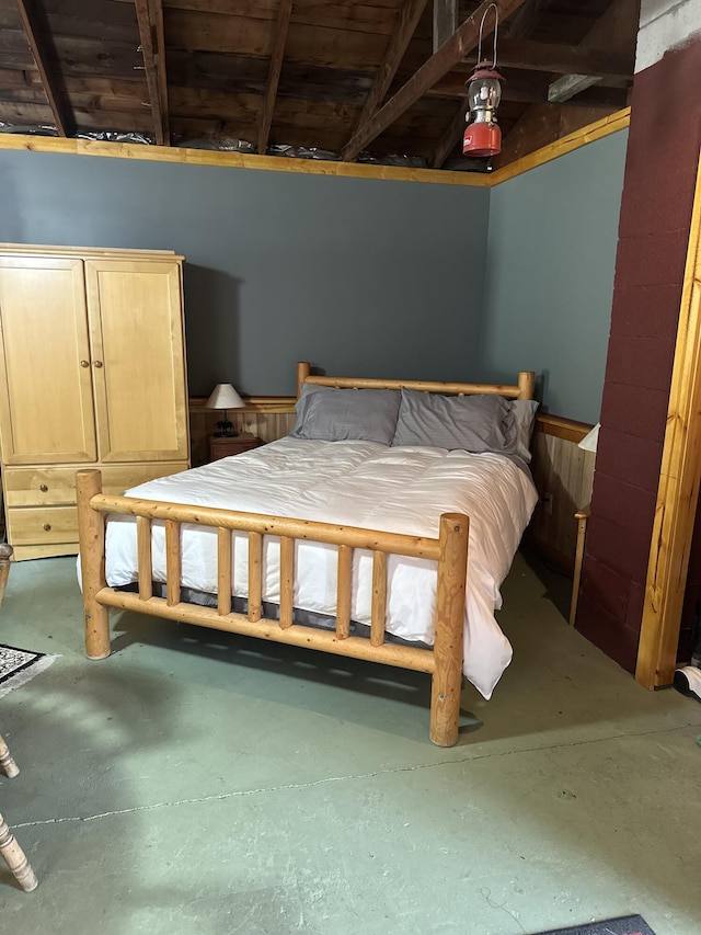 bedroom featuring concrete floors