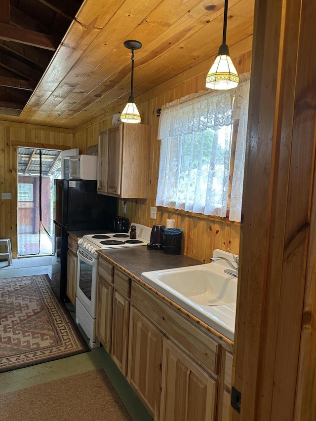 kitchen featuring white appliances, a sink, wooden walls, wood ceiling, and decorative light fixtures