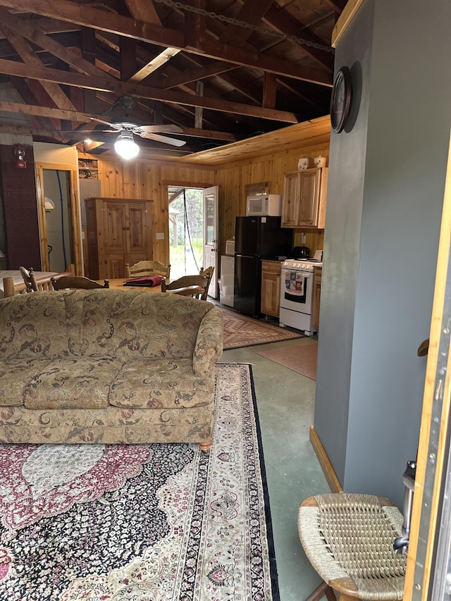 living room featuring wood walls, ceiling fan, and concrete floors
