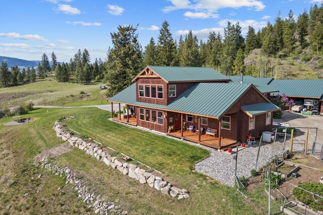 40 Happy Jack Rd, Curlew, WA 99118 - rear view of house with a yard, metal roof, and a porch