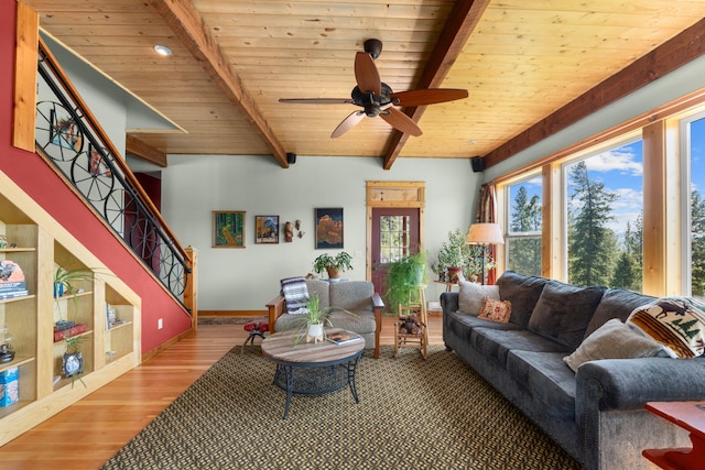 40 Happy Jack Rd, Curlew, WA 99118 - living room featuring wood finished floors, a ceiling fan, beamed ceiling, wooden ceiling, and stairway