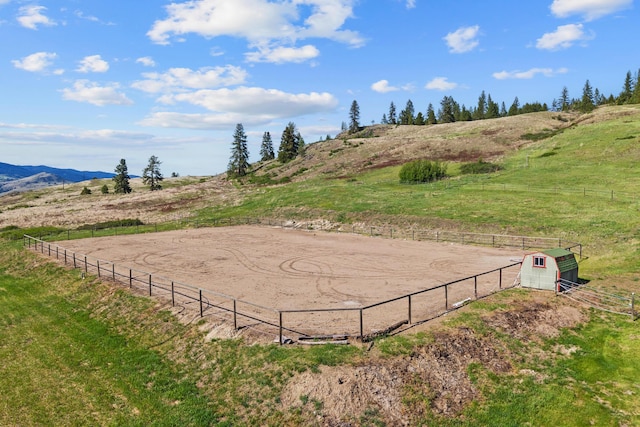 40 Happy Jack Rd, Curlew, WA 99118 - view of yard with a view of rural / pastoral area, fence, an outbuilding, a mountain view, and an outdoor riding arena