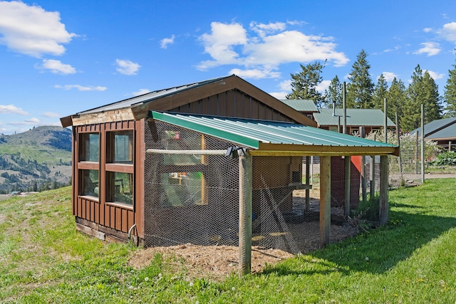 40 Happy Jack Rd, Curlew, WA 99118 - view of side of property with board and batten siding, exterior structure, an outbuilding, and a mountain view