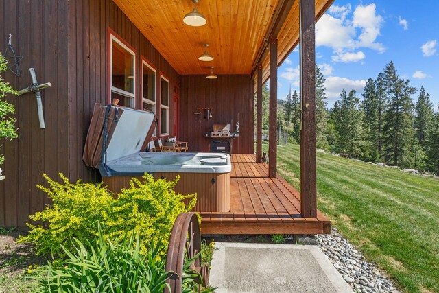 40 Happy Jack Rd, Curlew, WA 99118 - wooden deck featuring a hot tub, a lawn, and area for grilling