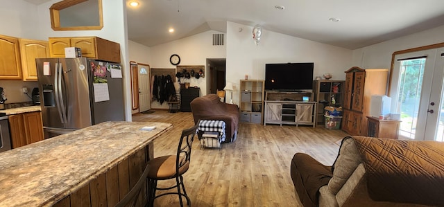 1527 Pingston Creek Rd, Kettle Falls, WA 99141 - living room featuring visible vents, light wood-type flooring, and high vaulted ceiling