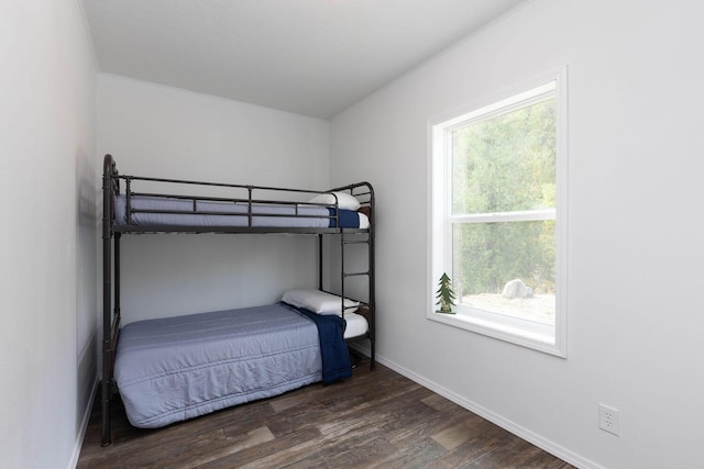 bedroom featuring dark hardwood / wood-style flooring