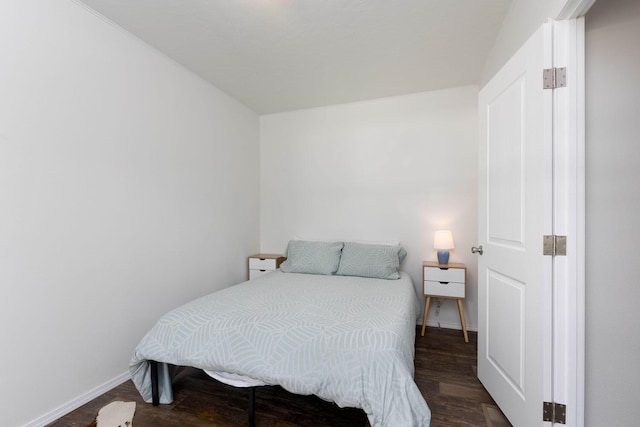 bedroom featuring dark hardwood / wood-style floors