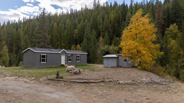 rear view of house with a lawn