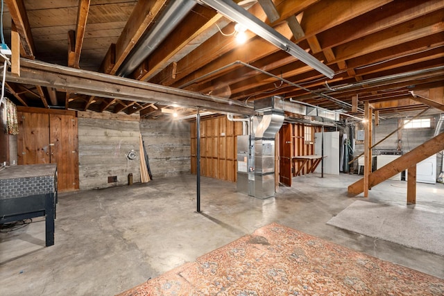 basement featuring heating unit