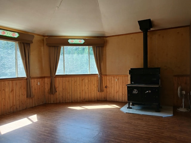 4224 Grouse Creek Rd Unit C, Loon Lake, WA 99148 - unfurnished living room with a wood stove, wood finished floors, and a healthy amount of sunlight