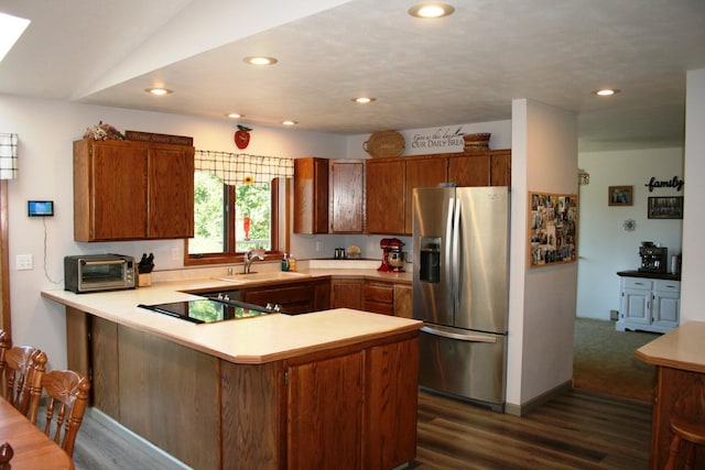 4738 Price Rd, Clayton, WA 99110 - kitchen featuring stainless steel refrigerator with ice dispenser, a peninsula, light countertops, black electric stovetop, and a sink