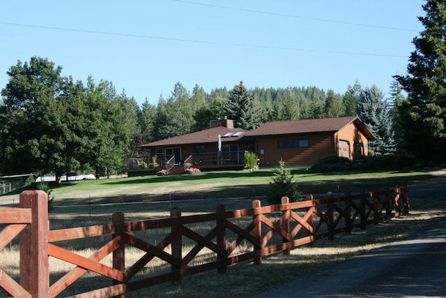 4738 Price Rd, Clayton, WA 99110 - view of front facade featuring a wooded view and a wooden deck