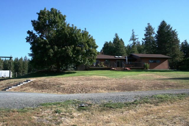 4738 Price Rd, Clayton, WA 99110 - view of green lawn with a wooden deck