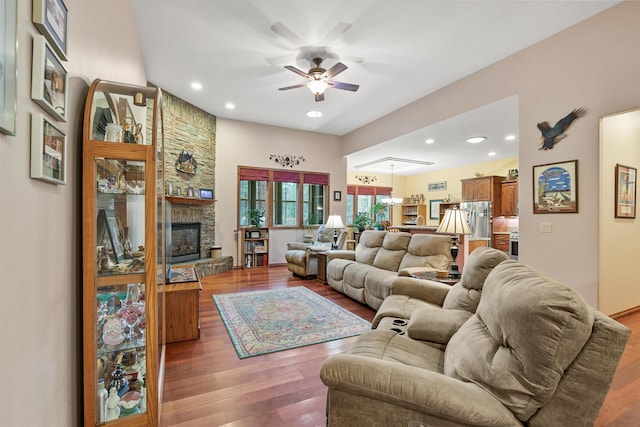 420 Palmer Ln, Chewelah, WA 99109 - living room with a fireplace, ceiling fan with notable chandelier, recessed lighting, and wood finished floors