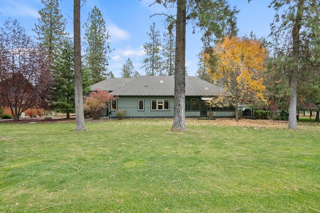 420 Palmer Ln, Chewelah, WA 99109 - back of house with a lawn and roof with shingles