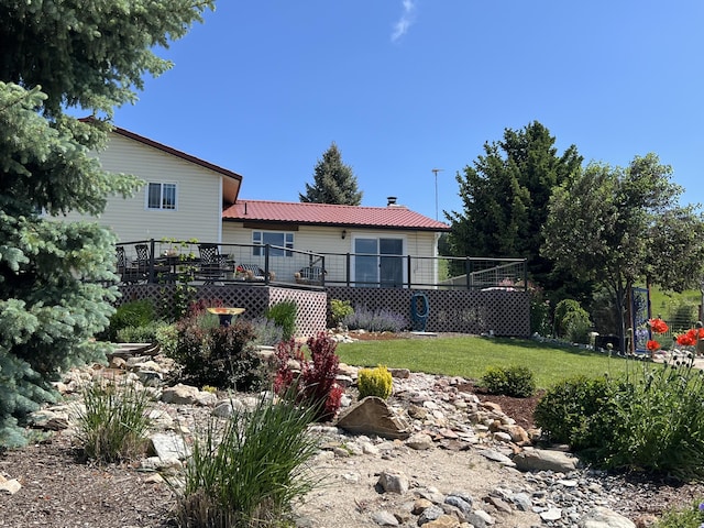 717 Conrad Hill Way, Colville, WA 99114 - rear view of property featuring a deck, a lawn, and metal roof