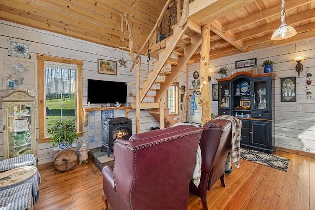 living area featuring wooden walls, wood ceiling, and hardwood / wood-style floors