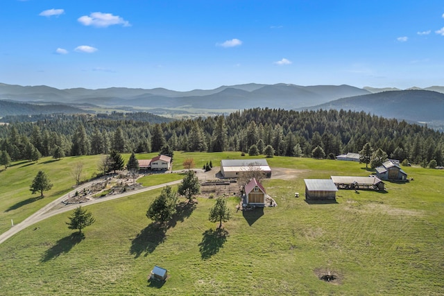 bird's eye view featuring a view of trees and a mountain view