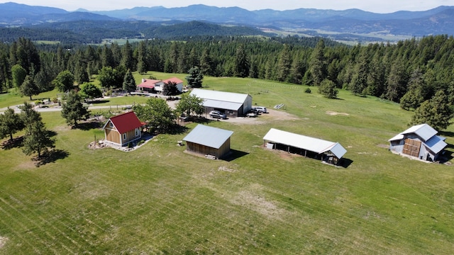 717 Conrad Hill Way, Colville, WA 99114 - overview of rural landscape featuring a mountain backdrop and a heavily wooded area
