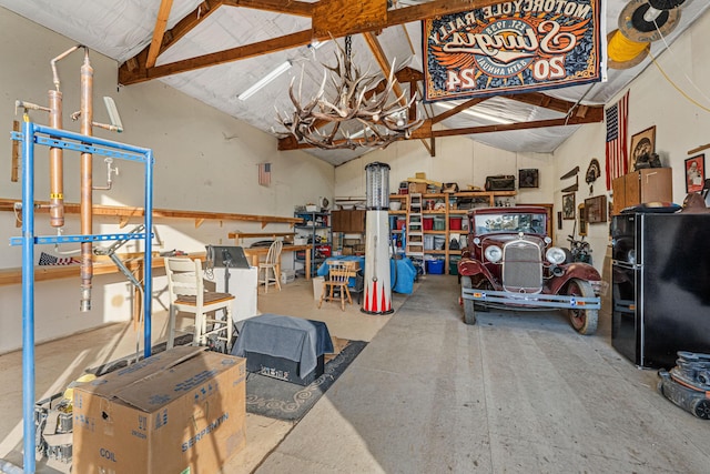 717 Conrad Hill Way, Colville, WA 99114 - garage featuring freestanding refrigerator