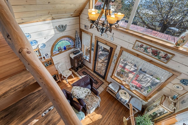717 Conrad Hill Way, Colville, WA 99114 - staircase with wooden walls, a chandelier, wood-type flooring, and vaulted ceiling