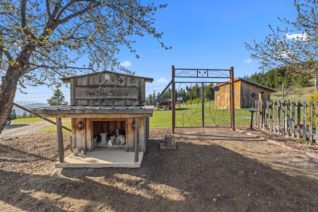 exterior space with fence and an outdoor structure