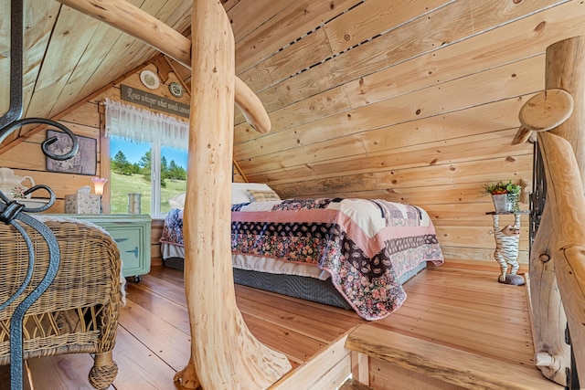 bedroom featuring wood ceiling, wood walls, vaulted ceiling with beams, and hardwood / wood-style flooring