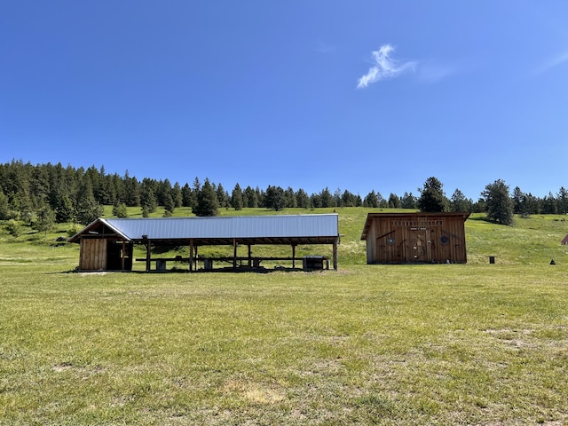 717 Conrad Hill Way, Colville, WA 99114 - view of green lawn featuring an outbuilding and central AC unit