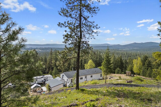 property view of mountains with a wooded view