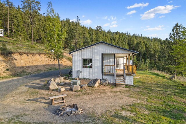 view of outbuilding featuring a wooded view
