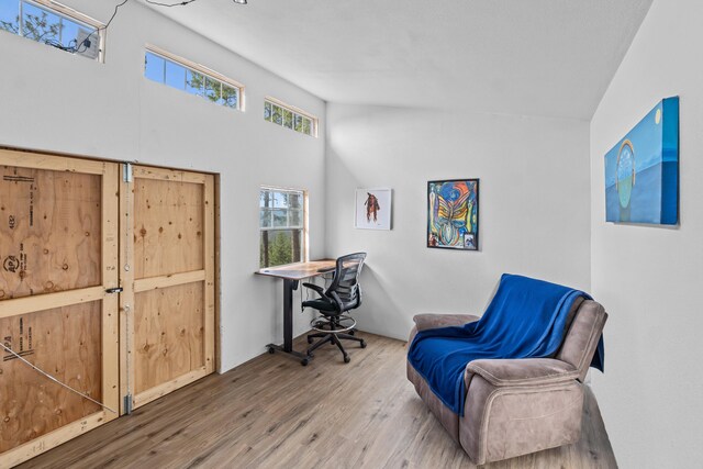home office with wood finished floors