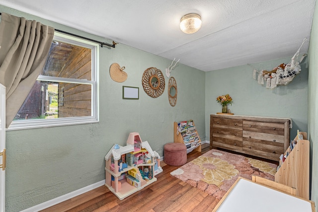 1625 Bear Mountain Way, Kettle Falls, WA 99141 - bedroom featuring baseboards and wood finished floors