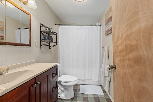 1625 Bear Mountain Way, Kettle Falls, WA 99141 - bathroom featuring vanity, tile patterned floors, toilet, and shower / bath combo with shower curtain