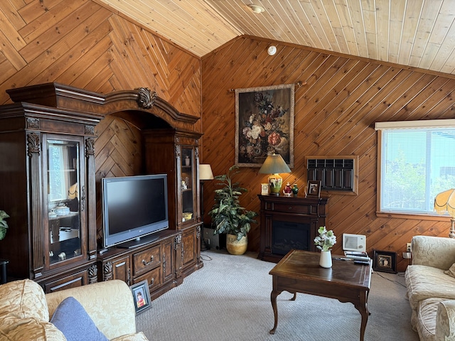 11 Crestview Dr, Kettle Falls, WA 99141 - living area with lofted ceiling, carpet floors, wood walls, a fireplace, and wood ceiling