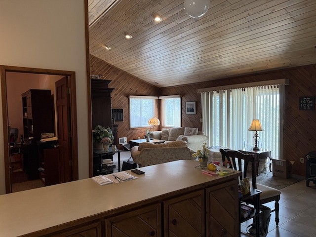 11 Crestview Dr, Kettle Falls, WA 99141 - kitchen featuring wooden walls, lofted ceiling, wood ceiling, light countertops, and light tile patterned floors