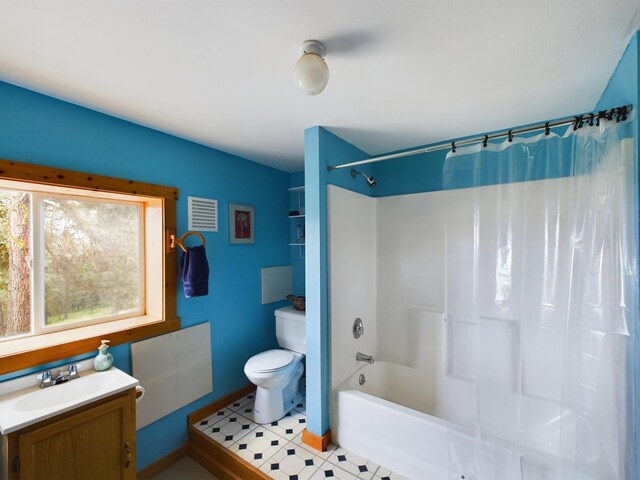 full bathroom featuring vanity, toilet, and shower / bath combo with shower curtain