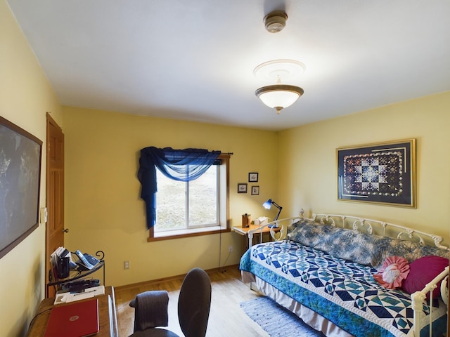 bedroom with hardwood / wood-style flooring