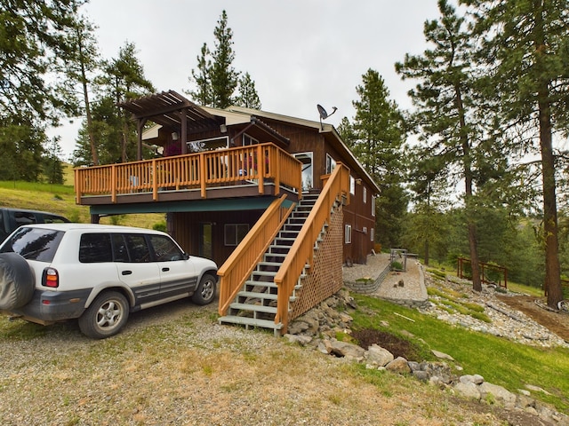 back of house with a wooden deck