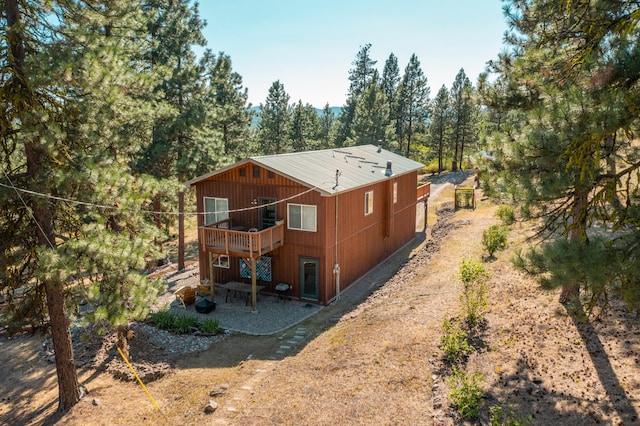 rear view of property with a deck