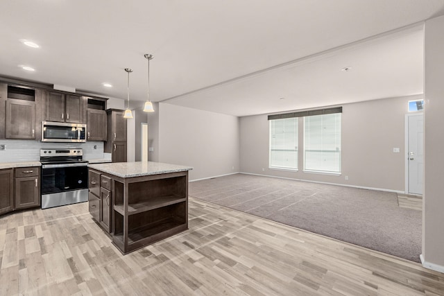 906 Valley Ave, Chewelah, WA 99109 - kitchen featuring appliances with stainless steel finishes, open shelves, dark brown cabinets, baseboards, and light wood-style flooring