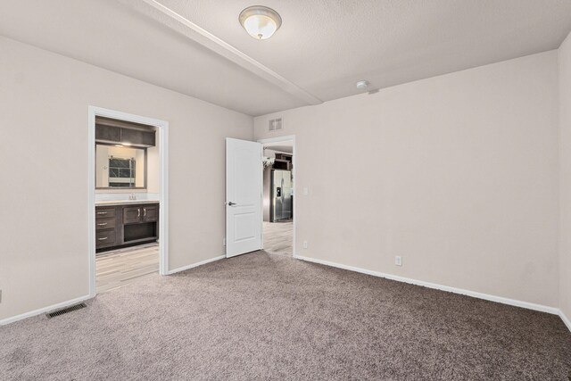 906 Valley Ave, Chewelah, WA 99109 - spare room with baseboards, carpet flooring, and visible vents