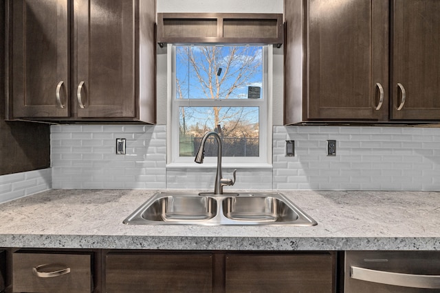 906 Valley Ave, Chewelah, WA 99109 - kitchen with a sink, backsplash, dark brown cabinetry, and light countertops