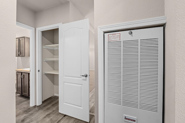 906 Valley Ave, Chewelah, WA 99109 - room details with wood finished floors and a heating unit