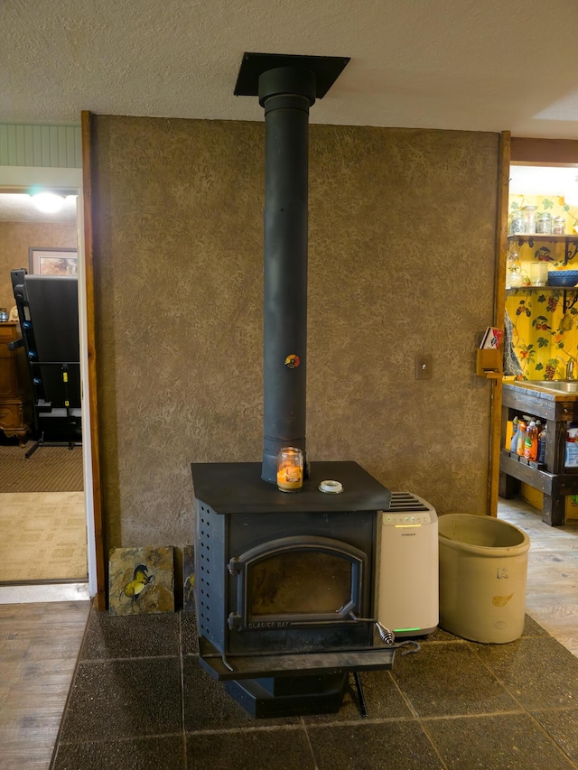 1239 Kewa Meteor Rd, Inchelium, WA 99138 - detailed view of a wood stove and wood finished floors