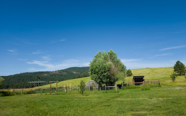 1239 Kewa Meteor Rd, Inchelium, WA 99138 - view of yard with a view of countryside, an outdoor structure, and a mountain view