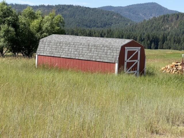 1239 Kewa Meteor Rd, Inchelium, WA 99138 - view of shed featuring a forest view and a mountain view