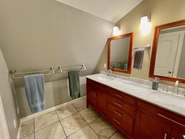 bathroom with tile patterned flooring and vanity